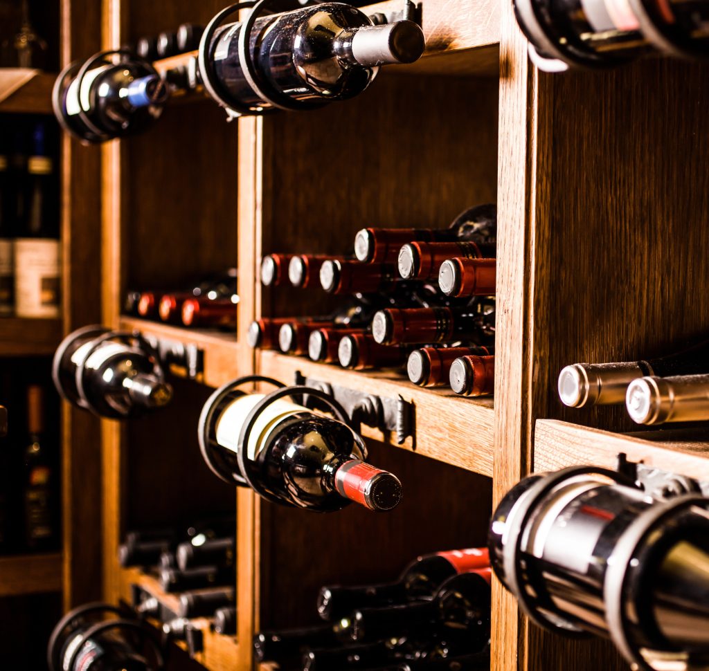 well-lit wine cellar with bottles displayed in different positions