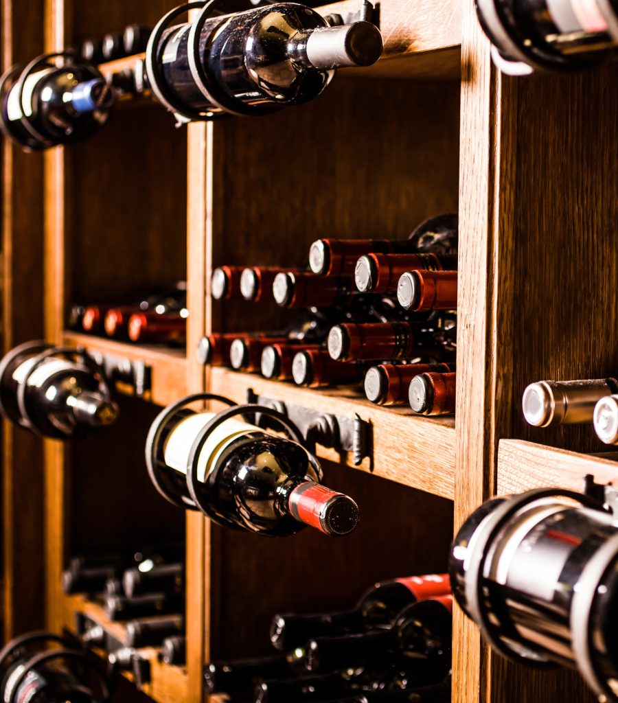 well-lit wine cellar with bottles displayed in different positions